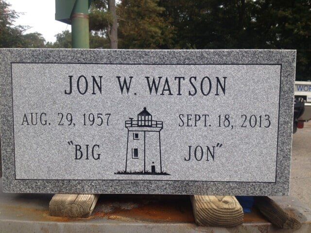 Flat grave marker with engraving