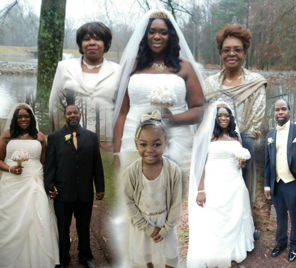 A group of people posing for a picture including a little girl