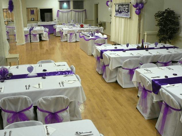 A room filled with tables and chairs and a sign that says once