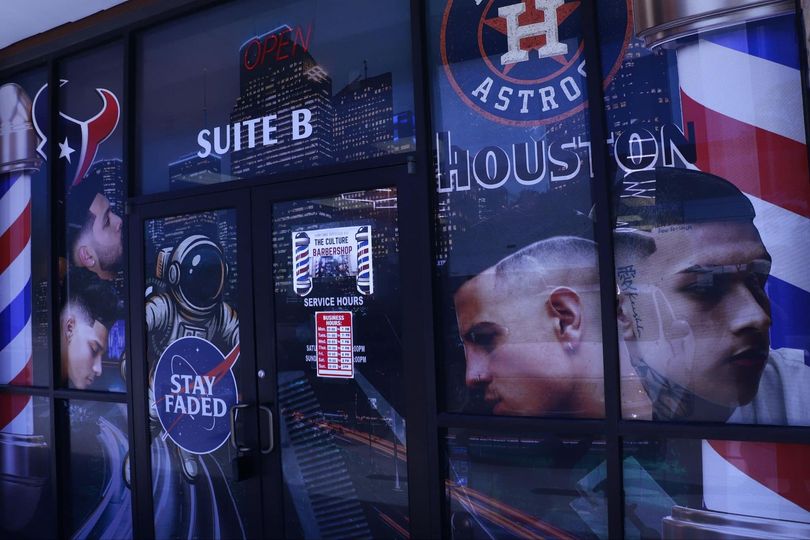 Houston Astros window display with player graphics, 