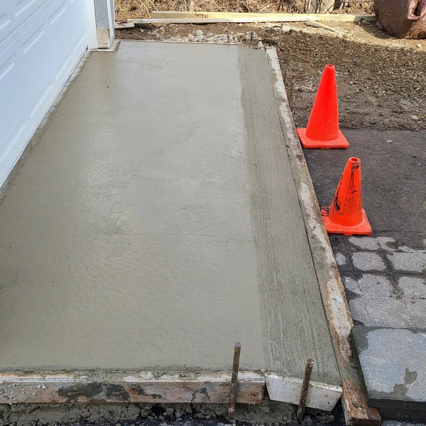 Worker Levels a Floor Cement — Wilmington, DE — Progress Paving and Sealcoating