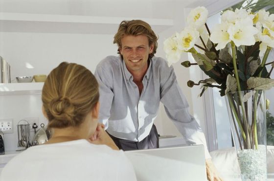 smiling man listening to worried woman