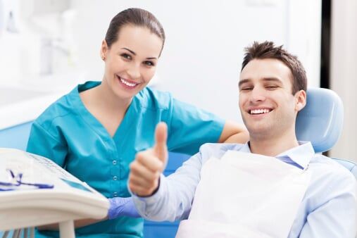 Man giving thumbs up at dentist office - Dentist in Schererville, IN