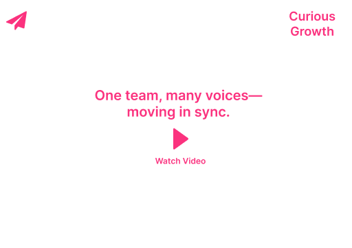 White webpage with pink text “One team, many voices—moving in sync” and a pink play button labeled “Watch Video”