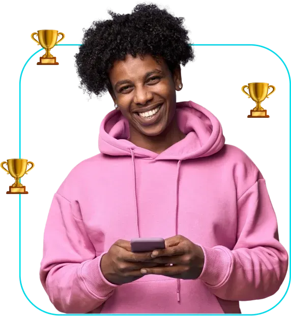 Smiling person in a pink hoodie holding a phone, with trophy icons around them.