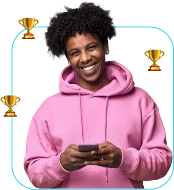 Smiling person in a pink hoodie holding a phone, with trophy icons around them.
