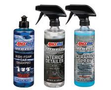 Three bottles of car detailing products by AMSOIL: car shampoo, interior detailer, and ceramic spray.