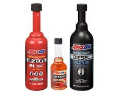 Three bottles of AMSOIL fuel additives: gasoline, QuickShot, and diesel cold flow.