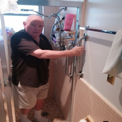 gentleman installing shower handle
