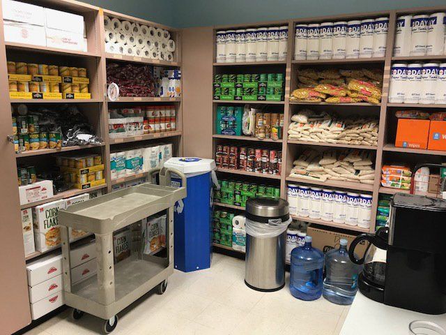 Food pantry with food items and paper products.