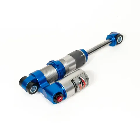 A blue and silver shock absorber on a white background.