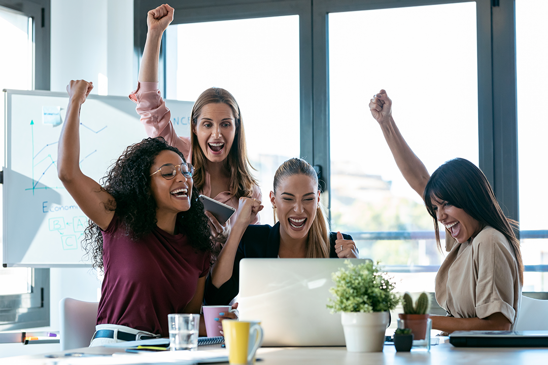Four Happy Smart Business Women Work