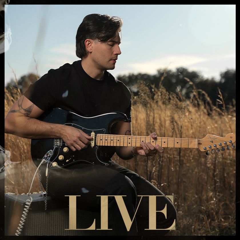 A man holding a guitar with the word merch on the bottom