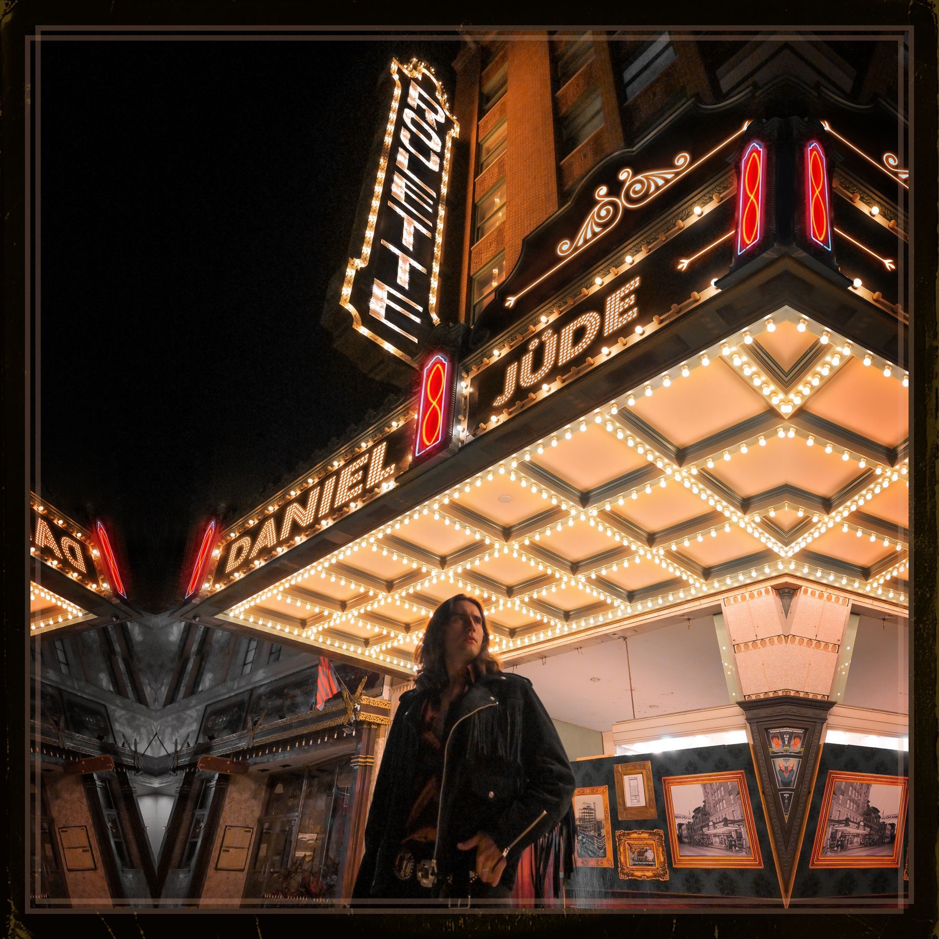 A woman is standing in front of the daniel and jude theater