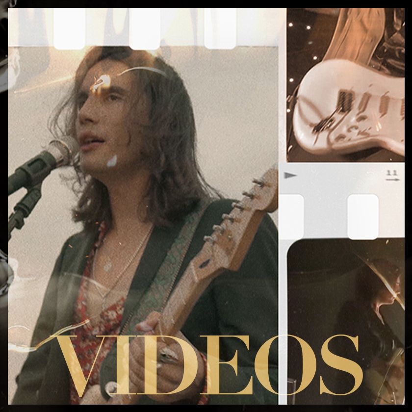 A man playing a guitar and singing into a microphone with the words videos below him