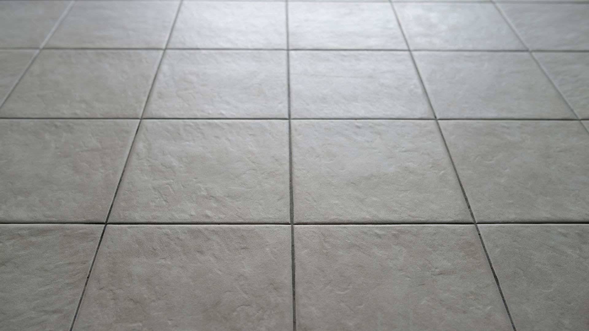 A close up of a tiled floor in a room.