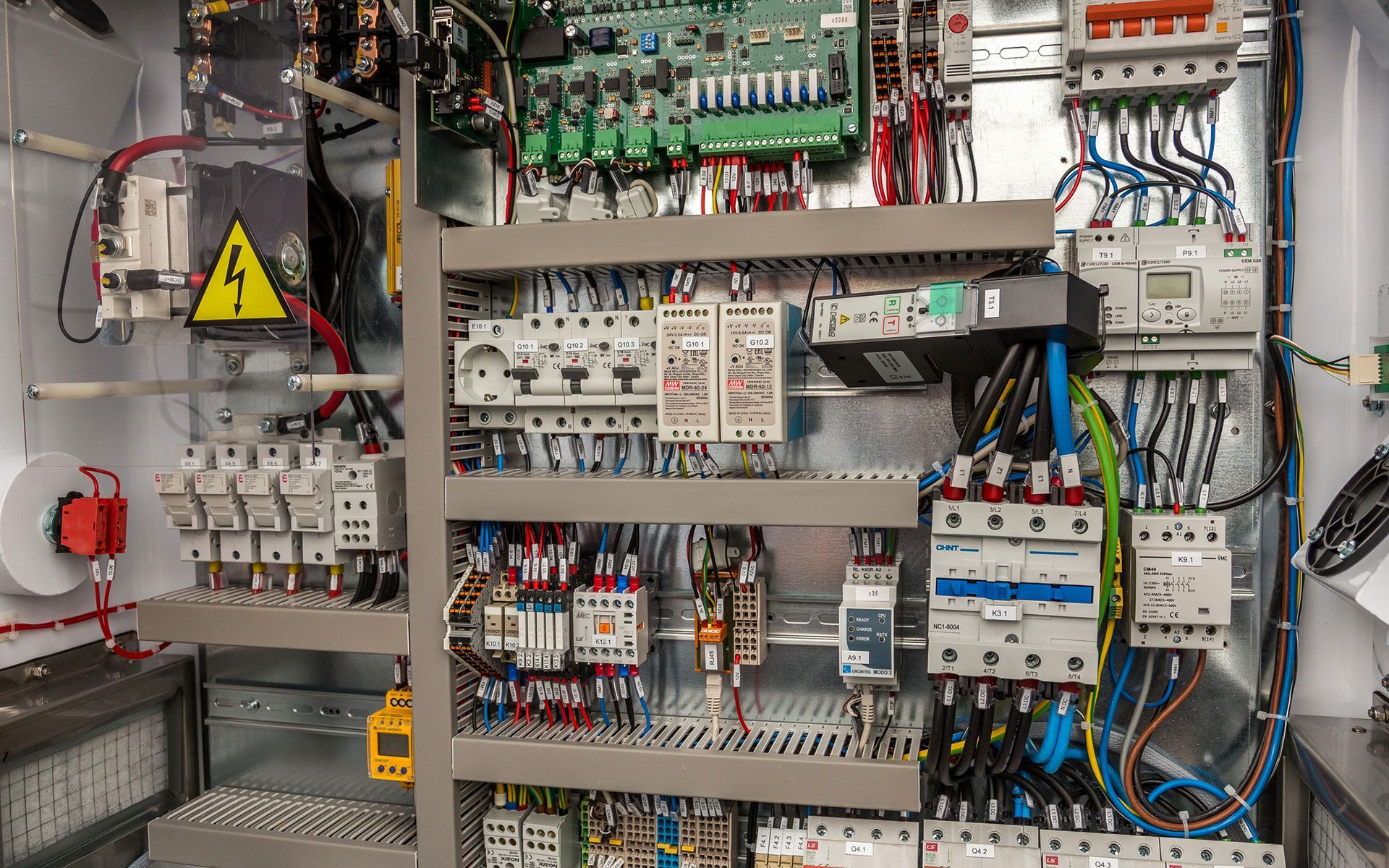 A close up of an electrical panel with a lot of wires.