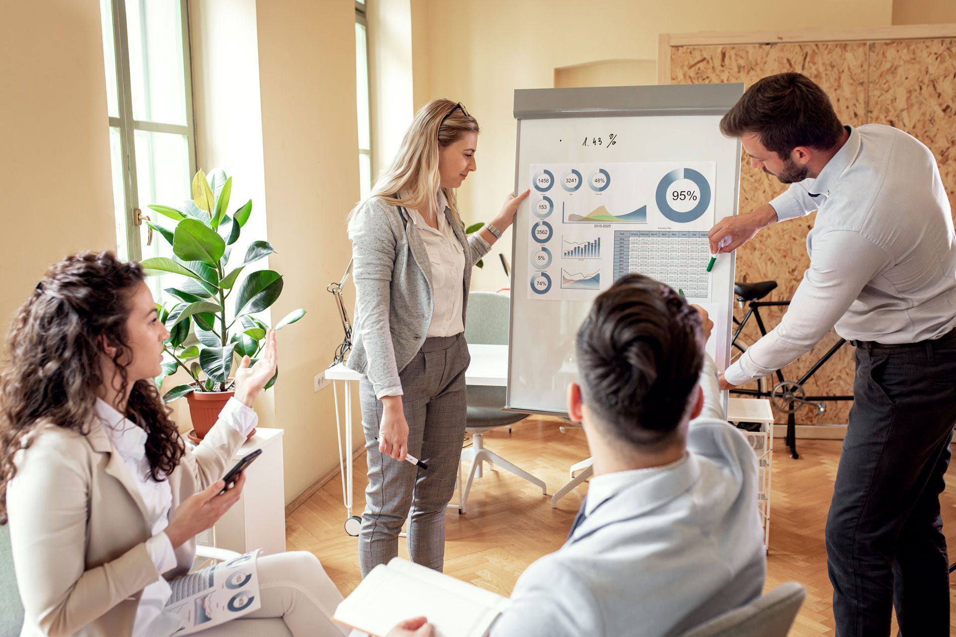 A group of people are having a meeting in an office.