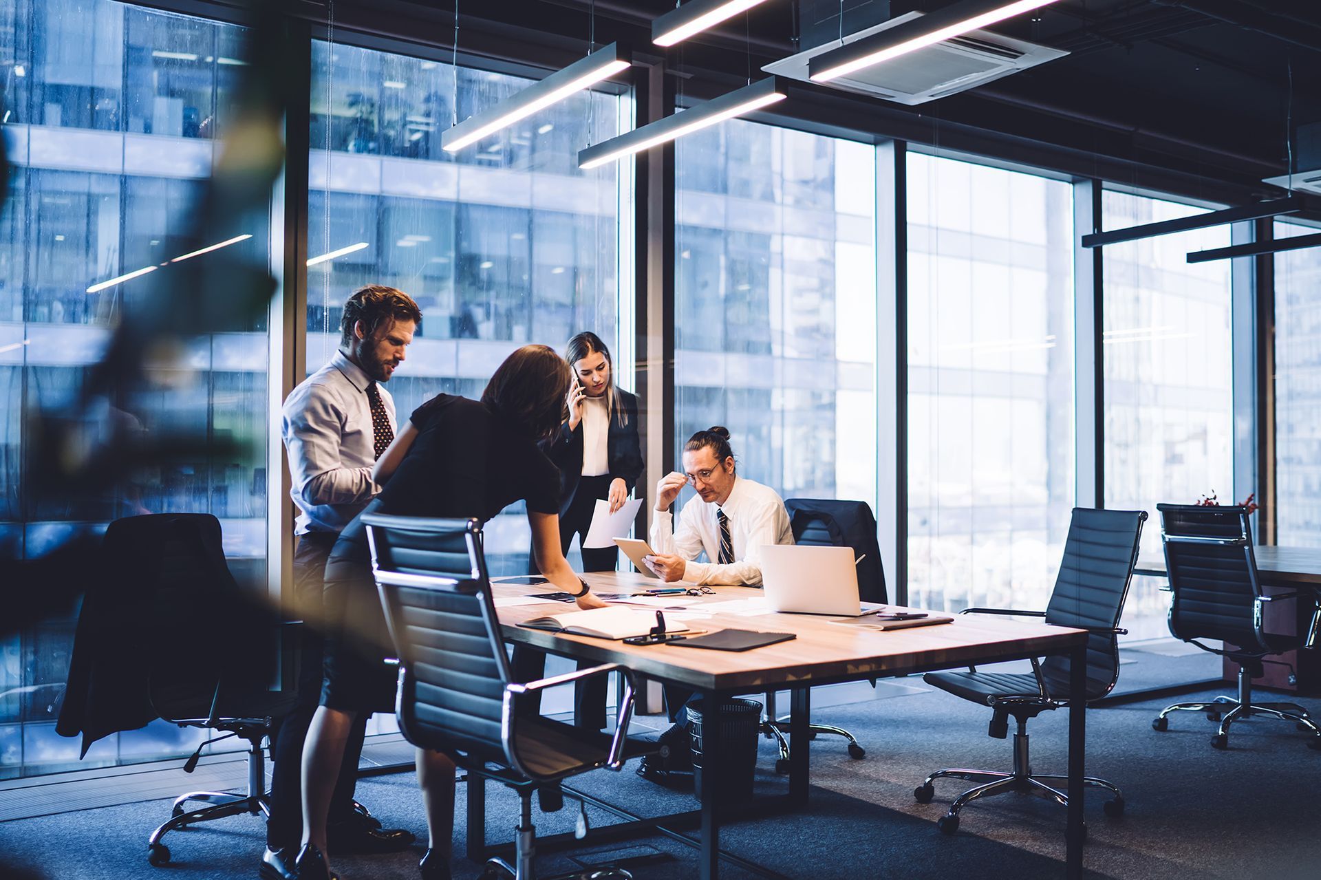 A group of business people are having a meeting in an office.