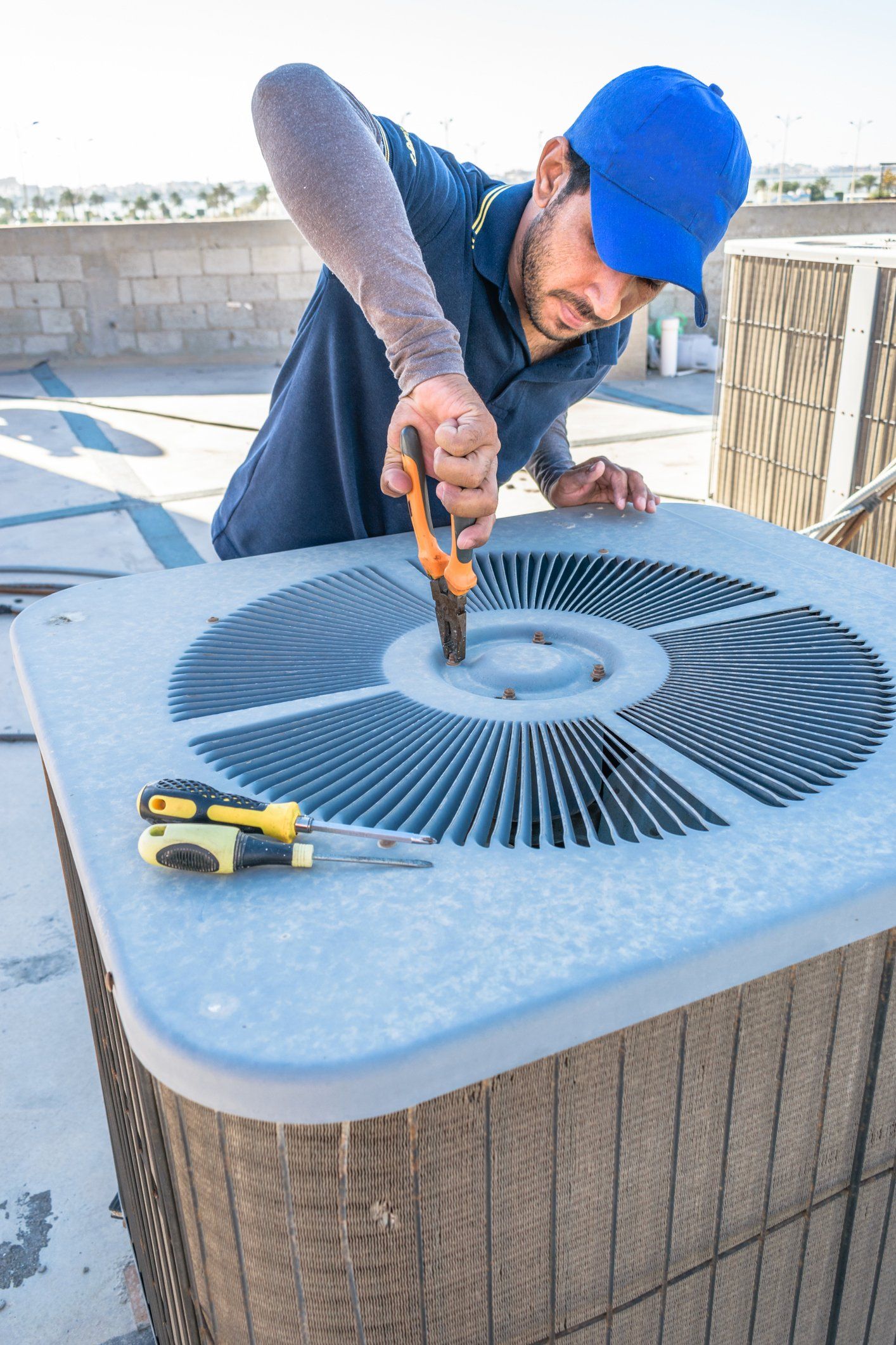 Technician Repairing Air Conditioner — Buhler, KS — Reimer Refrigeration