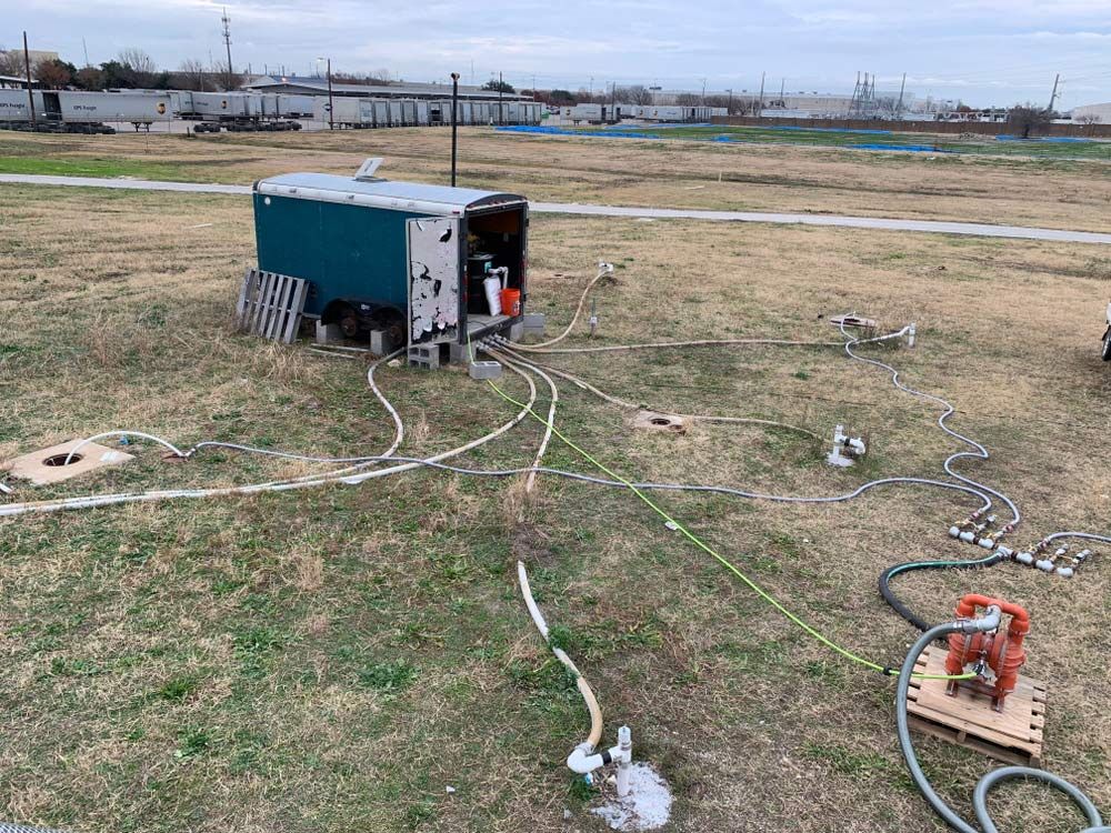 A Trailer Is Sitting in The Middle of A Field with A Bunch of Wires Coming out Of It — Northern Rivers Demolition & Asbestos in Casino, NSW