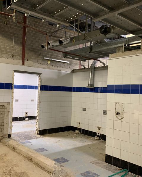A Room with White Tiles and Blue Stripes on The Walls — Northern Rivers Demolition & Asbestos in Skennars Head, NSW