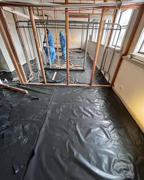 A Room Under Construction with A Black Tarp on The Floor — Northern Rivers Demolition & Asbestos in Skennars Head, NSW