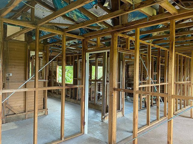 A House Is Being Built with Wooden Beams and Frames — Northern Rivers Demolition & Asbestos in Yamba, NSW