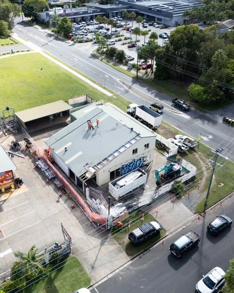 An Aerial View of A Building with Graffiti on The Roof — Northern Rivers Demolition & Asbestos in Skennars Head, NSW