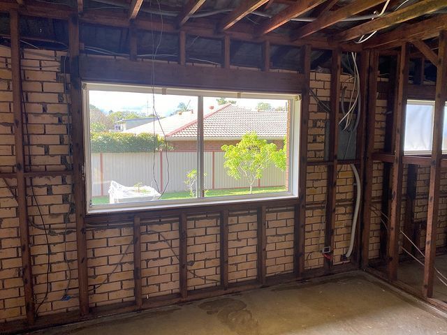 Wooden Brick Wall With Sliding Window — Northern Rivers Demolition & Asbestos in Tweed Heads, NSW