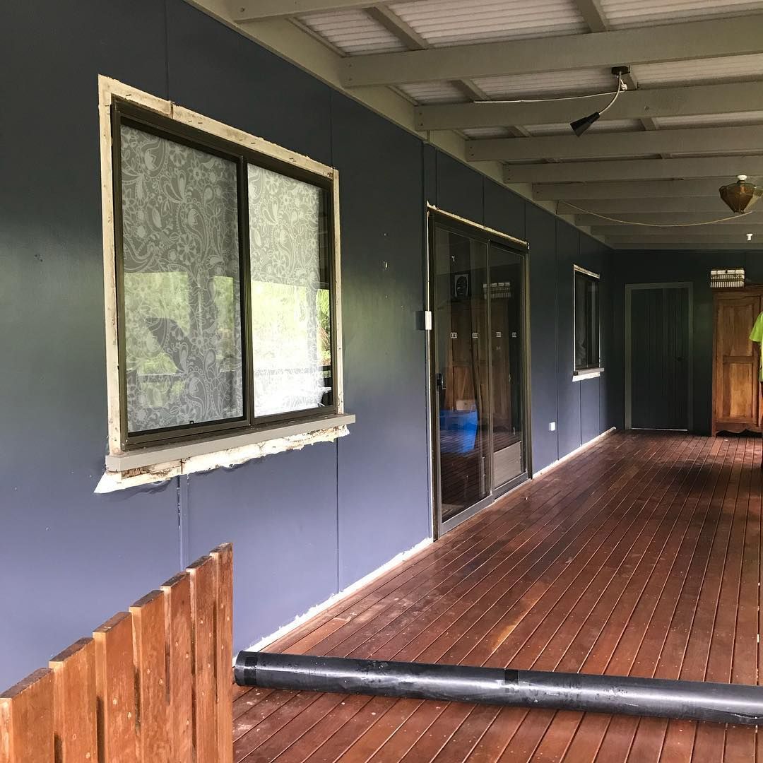 A Long Hallway with A Wooden Floor and A Ceiling Fan — Northern Rivers Demolition & Asbestos in Skennars Head, NSW