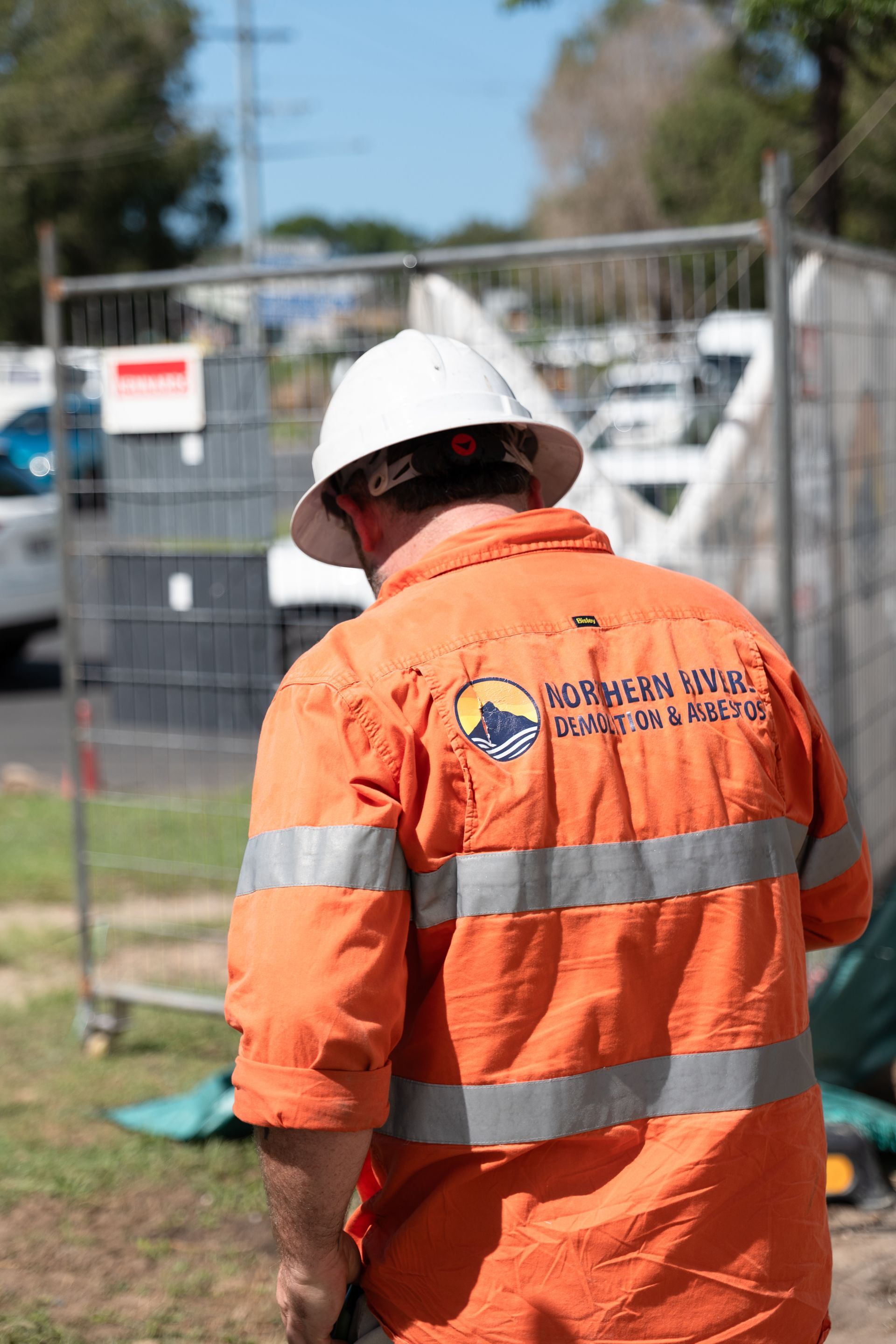 Man in White Hard Hat in Uniform on Construction Site — Northern Rivers Demolition & Asbestos in Skennars Head, NSW