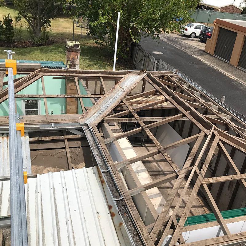 The Roof of A Building Is Being Demolished — Northern Rivers Demolition & Asbestos in Casino, NSW