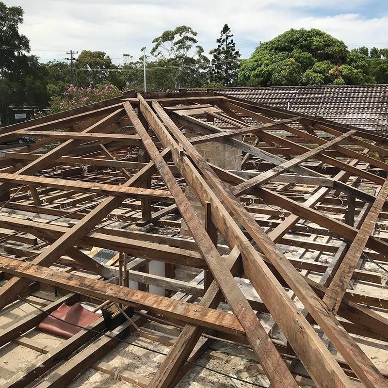A Roof with A Lot of Wooden Beams on It — Northern Rivers Demolition & Asbestos in Byron Bay, NSW