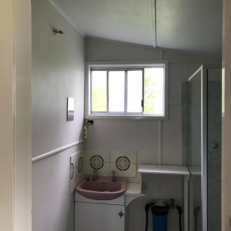 White Bathroom With Sliding Window — Northern Rivers Demolition & Asbestos in Byron Bay, NSW