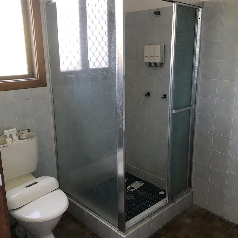 A Bathroom with A Toilet and A Shower Stall — Northern Rivers Demolition & Asbestos in Tweed Heads, NSW