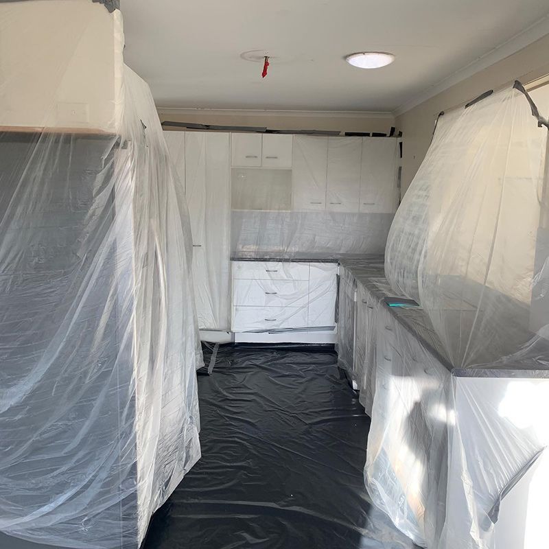 A Kitchen Is Covered in Plastic and Ready to Be Painted — Northern Rivers Demolition & Asbestos in Grafton, NSW