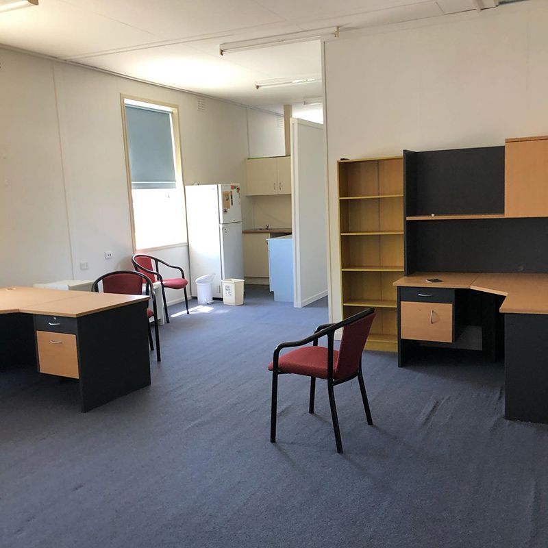 A Room with A Lot of Desks, Chairs, And Cabinets — Northern Rivers Demolition & Asbestos in Grafton, NSW