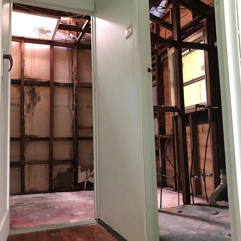 A Hallway with A Door Open Leading to A Building Under Construction — Northern Rivers Demolition & Asbestos in Ballina, NSW