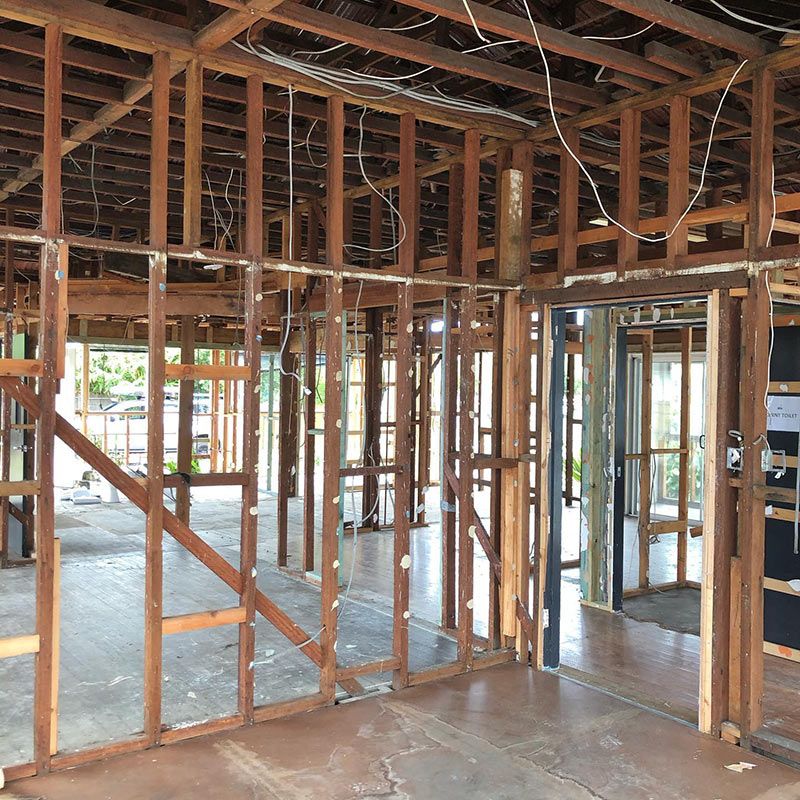 The Inside of A Building Under Construction with Wooden Beams — Northern Rivers Demolition & Asbestos in Yamba, NSW