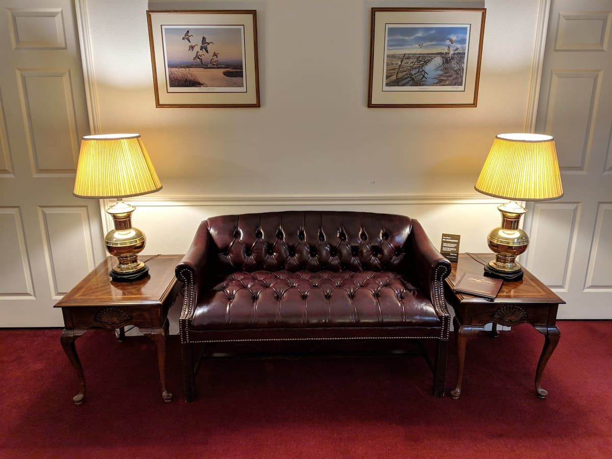 a living room with a couch and two lamps