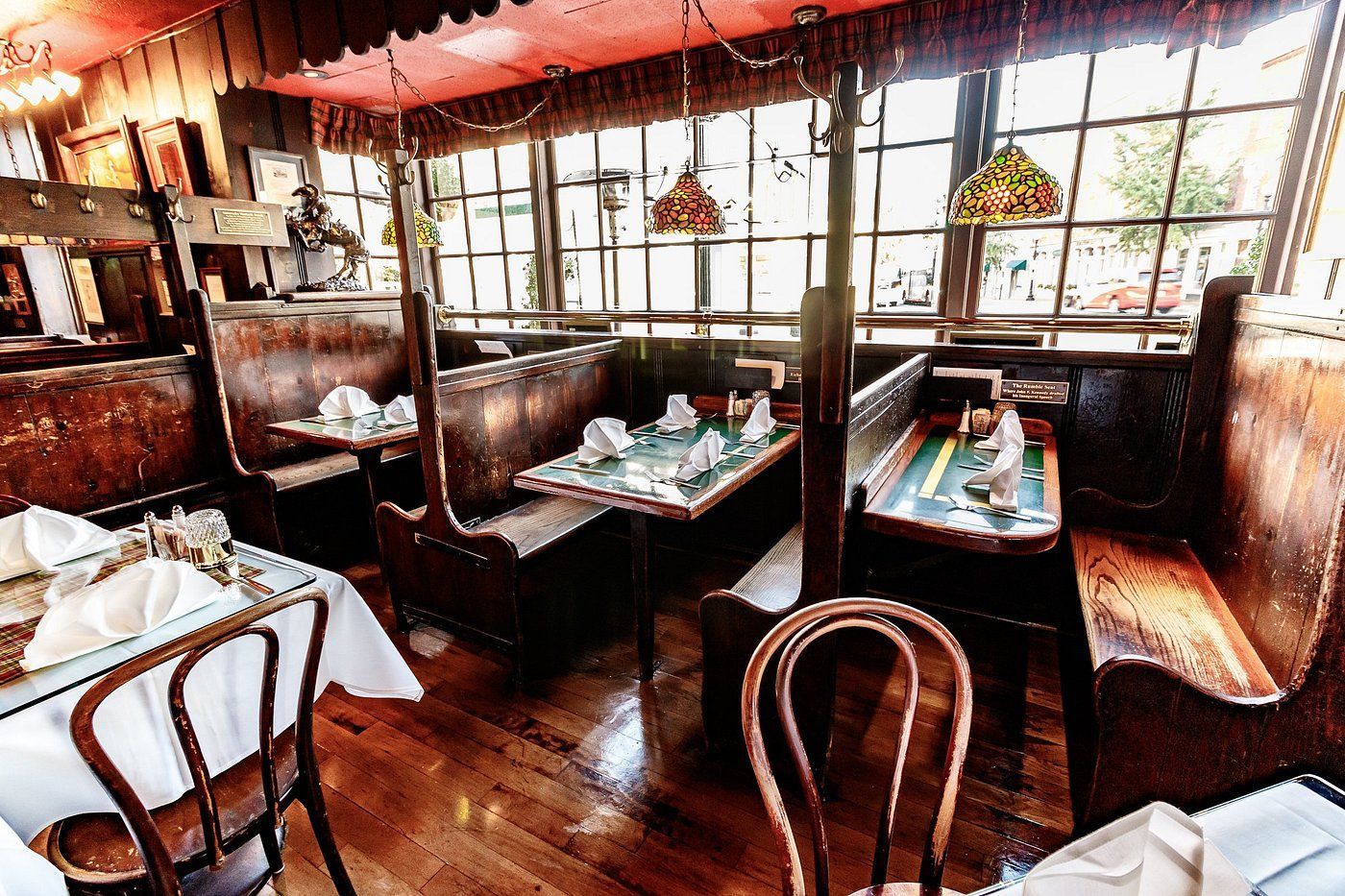 A man is standing in front of a model of a city