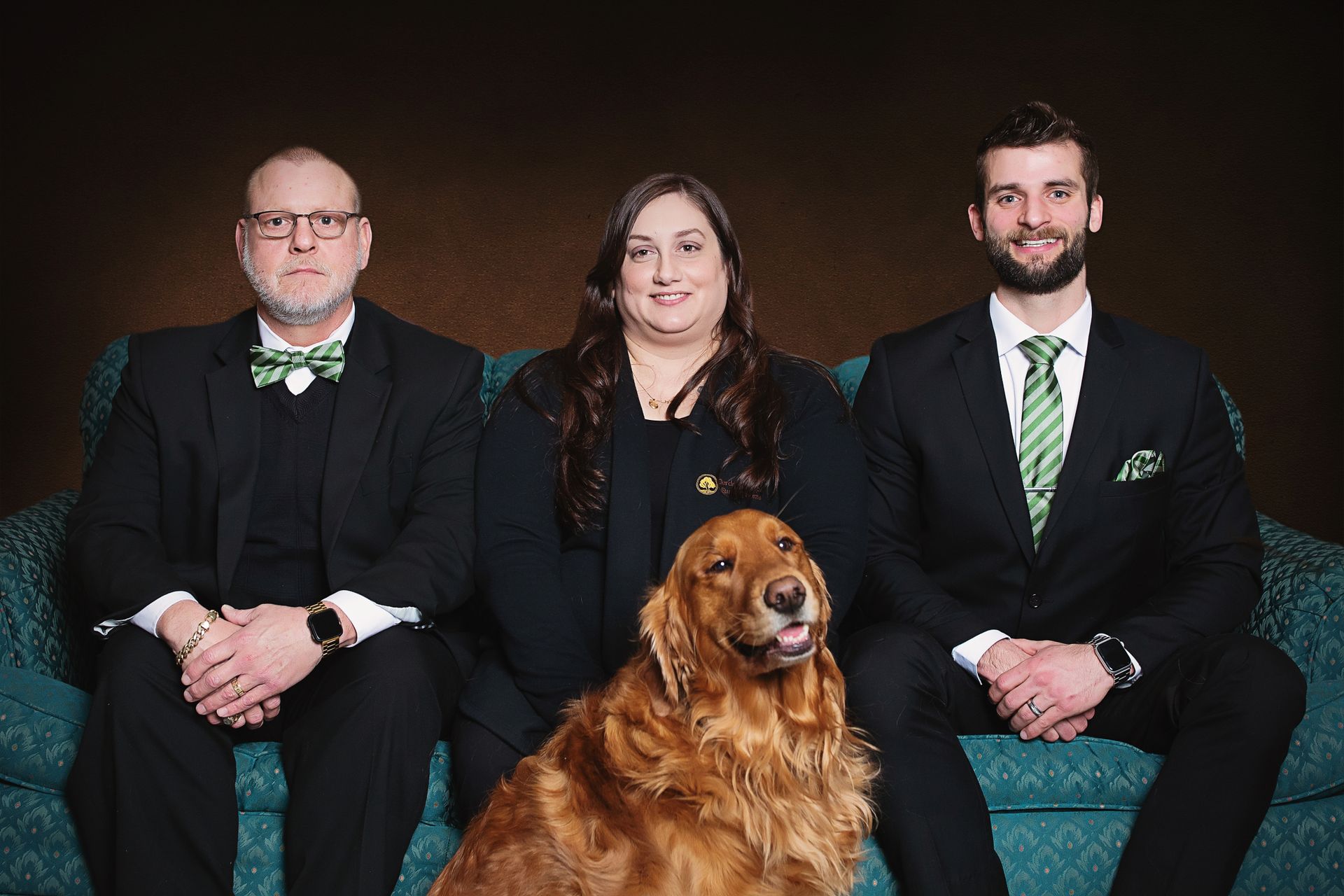 The front door of a house with a porch and plants in front of it.