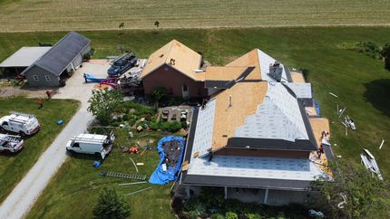 An aerial view of a house being remodeled with a new roof.