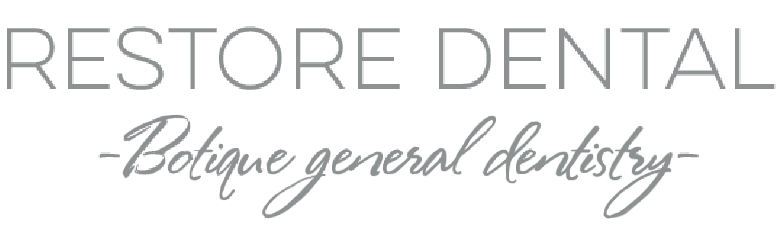 Restore Dental logo with light blue and gray text on a white background