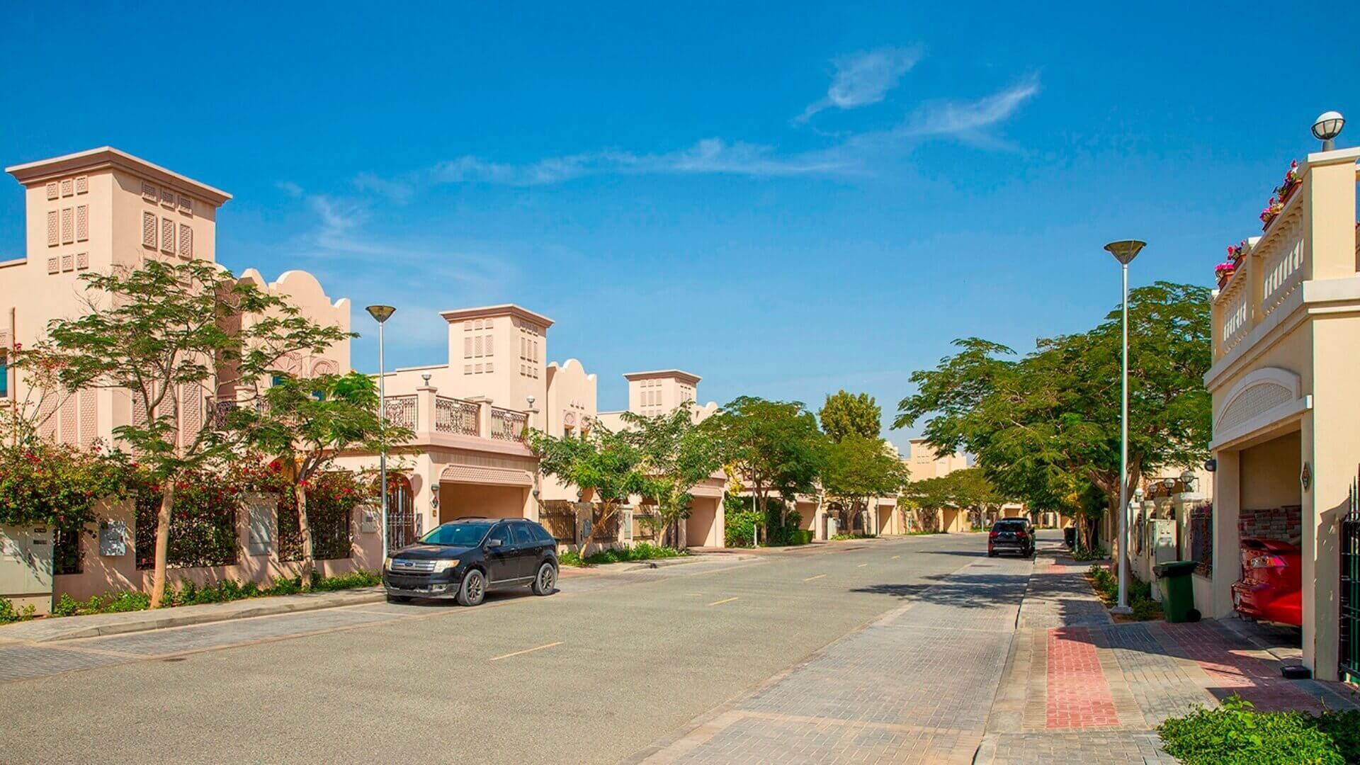 Live in Jumeirah Village Triangle, featuring modern villas, community parks, and family-friendly amenities