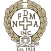 FDMA Inc. logo with a cross, laurel wreath, and a diamond, established in 1924.