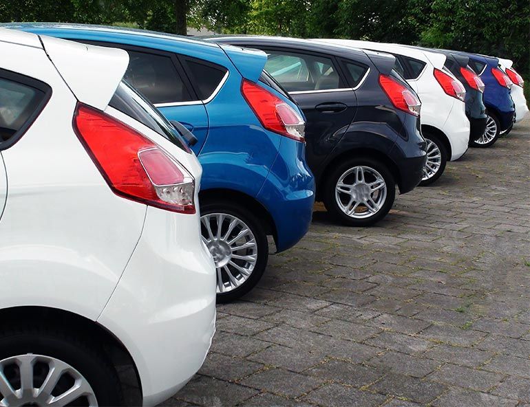 sun shield glass tinting cars parked in a row