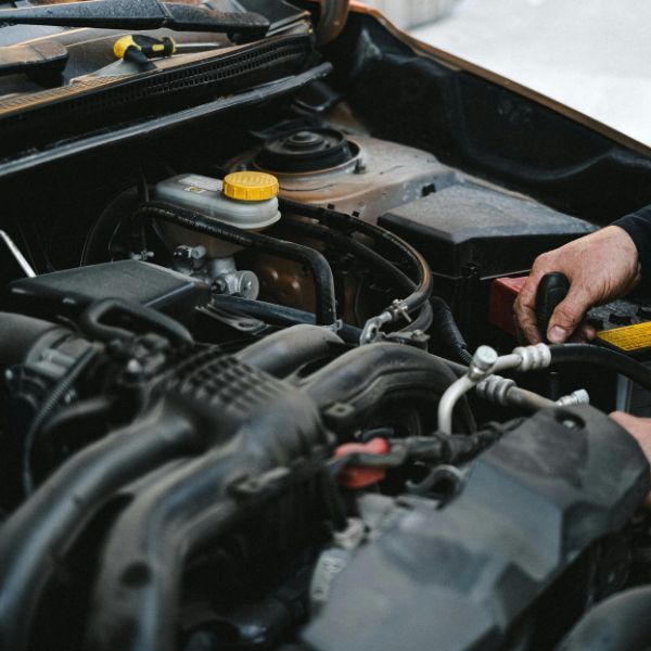 mechanic working on an engine