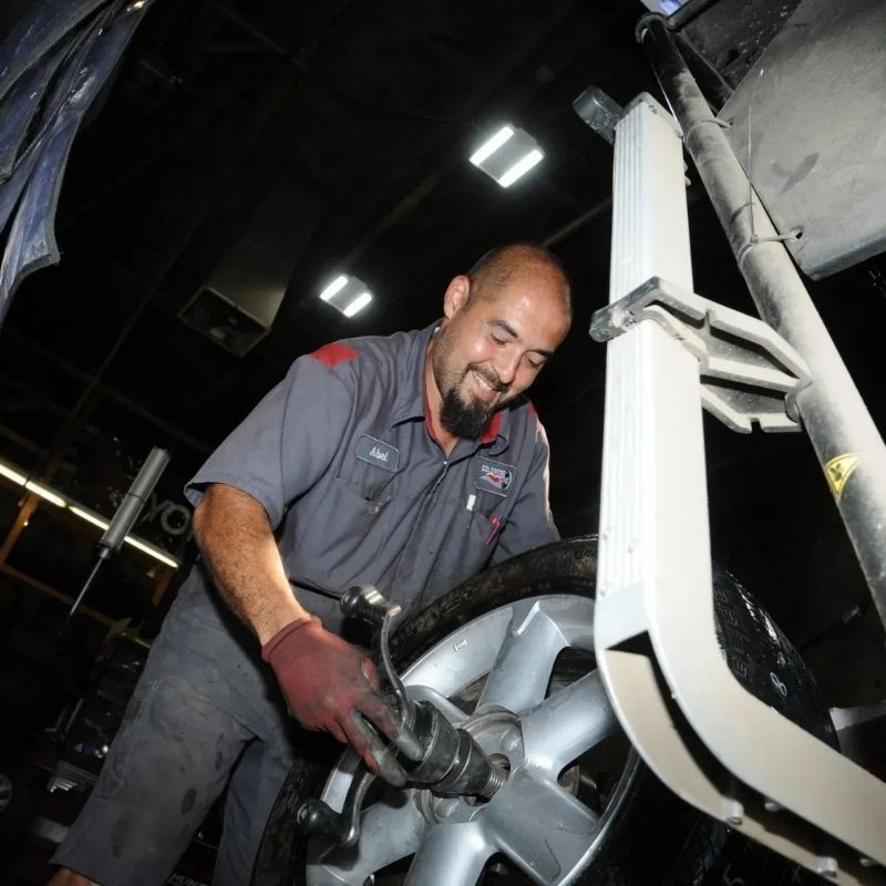 technician taking tire off